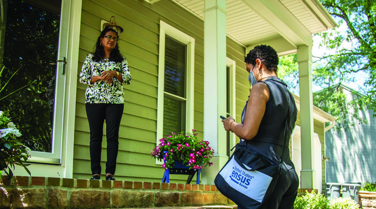 Census taker uses smartphone to interview citizen